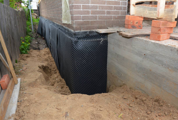 SJ Waterproofing Pros technician performing targeted Waterproofing assessment in Skokie, IL